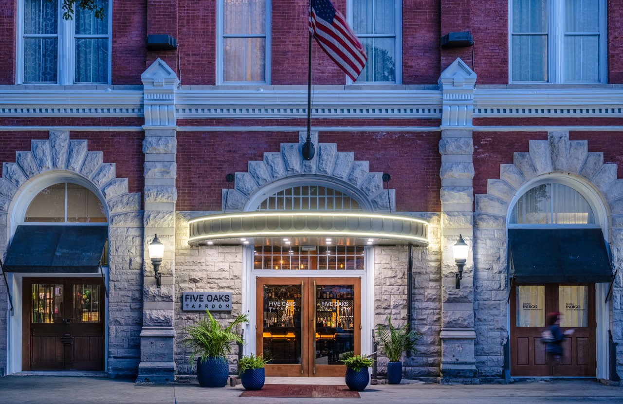 The entrance of Five Oaks Taproom inside Hotel Indigo Savannah Historic District